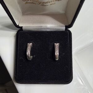 Elegant 14k White Gold half hoop diamond earrings.